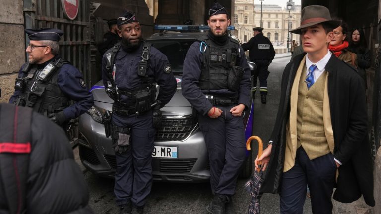 Mystery man in an AP photo after the Louvre heist creates a buzz
